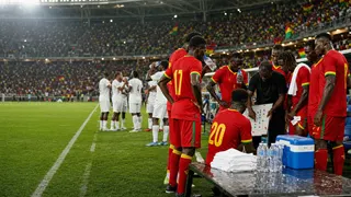 Ghana players and coaches using a hydration break during a World Cup match